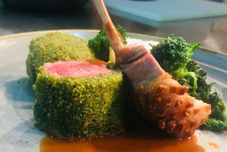 Herb-crusted rack of lamb with tenderstem broccoli and jus at Pulcinella, Cleveleys